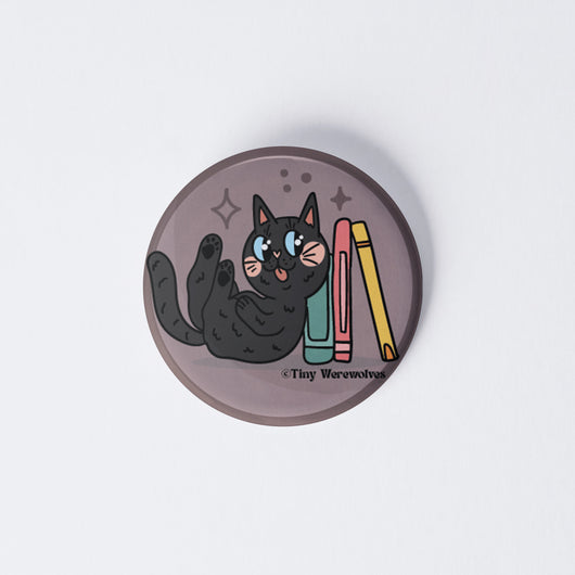Original artwork by Tiny Werewolves | Black Book Cat 1" Mini Button Pin in | Shop to get your gender neutral Metal Pinback Button