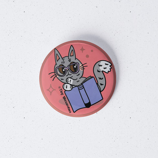 Original artwork by Tiny Werewolves | Grey Book Cat 1" Mini Button Pin in | Shop to get your gender neutral Metal Pinback Button