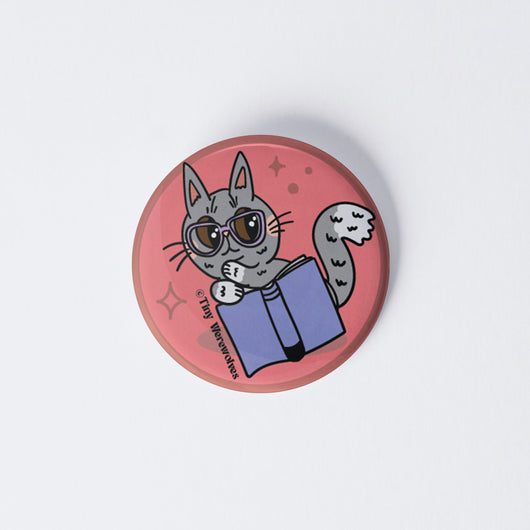 Original artwork by Tiny Werewolves | Grey Book Cat 1" Mini Button Pin in | Shop to get your gender neutral Metal Pinback Button