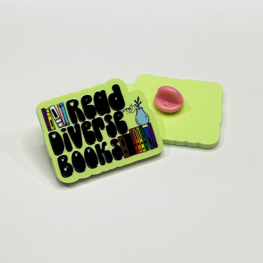 Original artwork by Tiny Werewolves | Read Diverse Books Acrylic Pin in | Shop to get your gender neutral Acrylic Pin