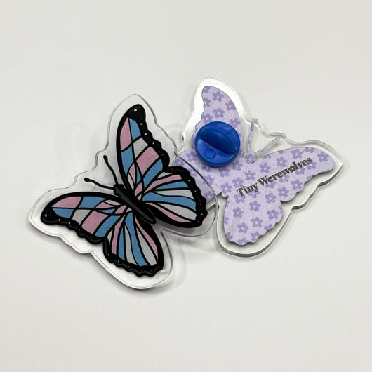 Original artwork by Tiny Werewolves | Trans Pastel Subtle Queer Butterfly Acrylic Pin in | Shop to get your gender neutral Acrylic Pin