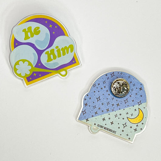 Original artwork by Tiny Werewolves | He / Him Pronouns Bubble Acrylic Pin in Clear | Shop to get your gender neutral Acrylic Pin